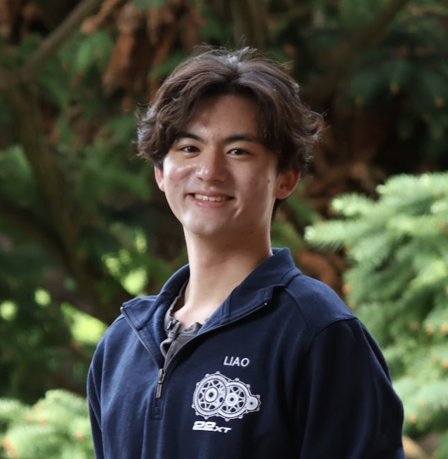 Justin Liao wearing a Blue Jay Racing team jacket